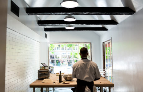 A cook making pasta in the kitchen